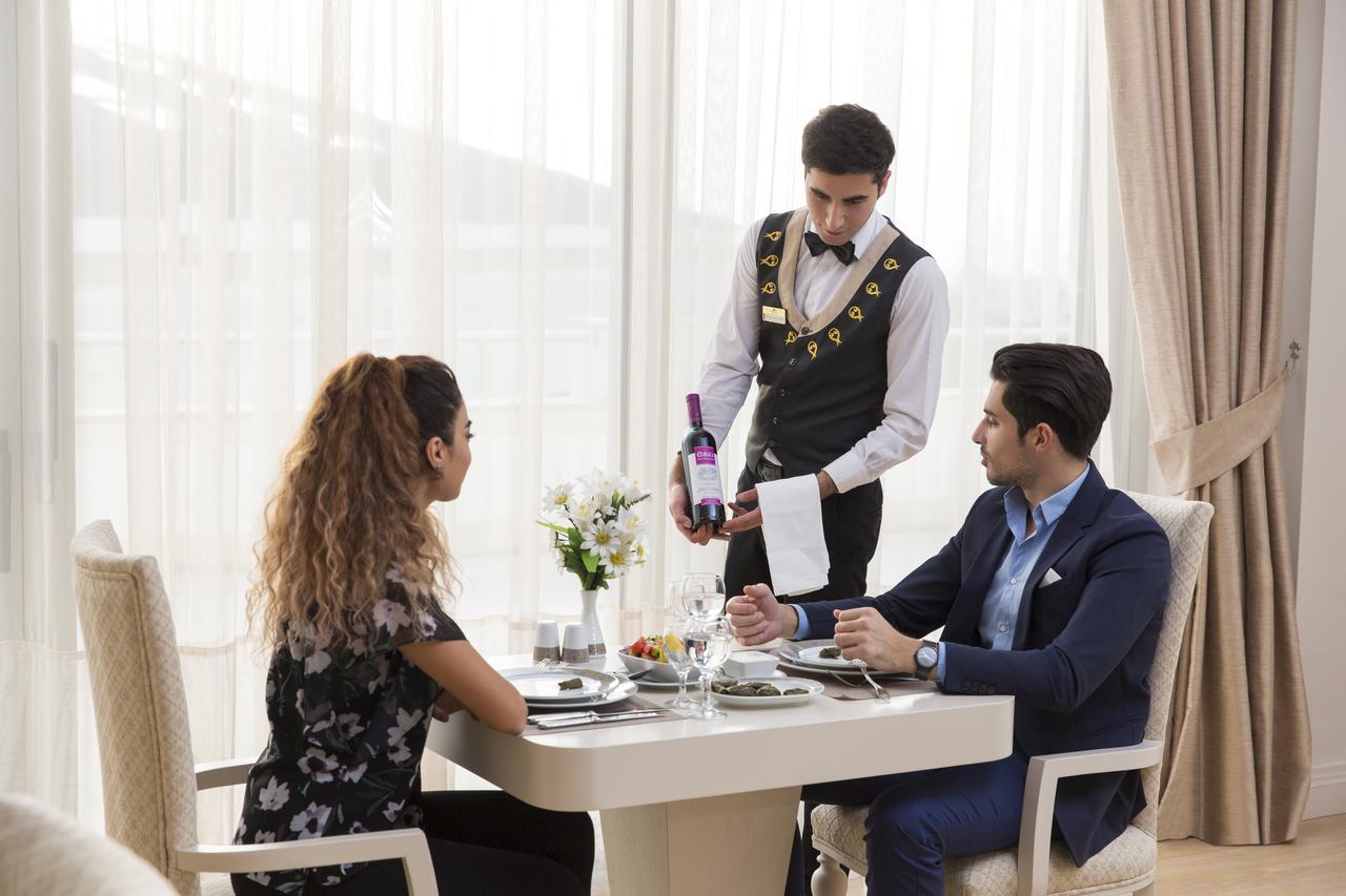 Gabala Garden Hotel Extérieur photo A butler serving wine
